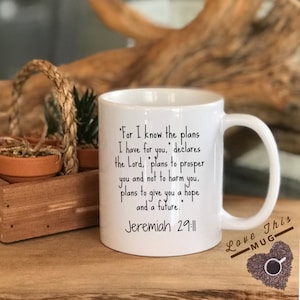 May include: White ceramic mug with a black inspirational quote from Jeremiah 29:11. The quote reads "For I know the plans I have for you, declares the Lord, plans to prosper you and not to harm you, plans to give you a hope and a future."