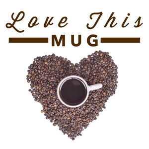 May include: A white coffee mug filled with coffee sits in the center of a heart shape made of coffee beans. The text "Love This Mug" is written above the heart.
