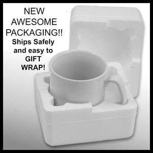 May include: A white ceramic mug with a handle is nestled in a white styrofoam packaging. The packaging is designed to protect the mug during shipping and makes it easy to gift wrap.