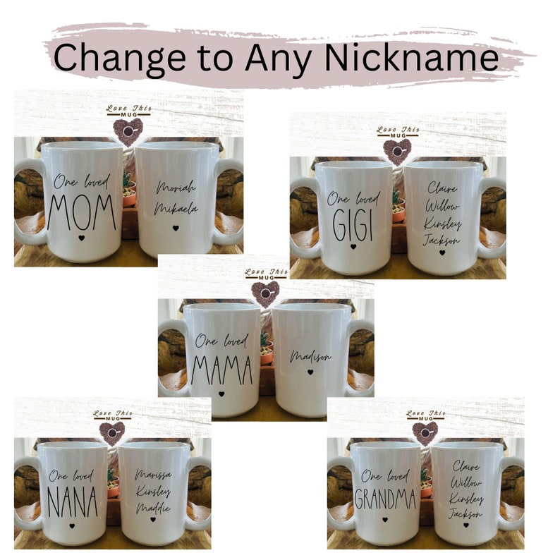May include: Six white ceramic mugs with black text. The mugs are arranged in two rows of three. Each mug has a different nickname on it, such as "Mom", "Gigi", "Grandma", "Mama", "Nana", and a personalized name. The mugs are all decorated with a small black heart.