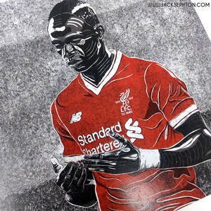 May include: Black and white illustration of a soccer player wearing a red jersey with the text "Standard Chartered" and the Liverpool Football Club logo. The jersey also has the text "1892 2017 L.F.C. 125 YEARS."