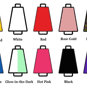 May include: Ten spools of thread arranged in two rows. Colors include yellow gold, white, red, rose gold, rainbow, royal blue, glow-in-the-dark, hot pink, black, and purple. Each spool is labeled with its corresponding color name underneath.