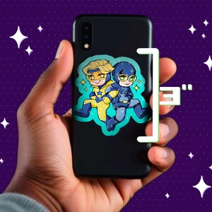 May include: Black smartphone case featuring a cartoon illustration of two superheroes in yellow and blue costumes. The image is set against a purple background with white star shapes.