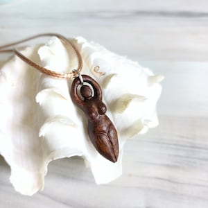 Wooden pendant of wiccan fertility mother goddess