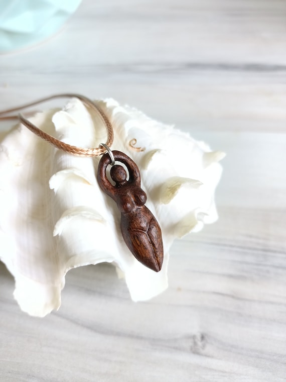 Wooden pendant of wiccan fertility mother goddess