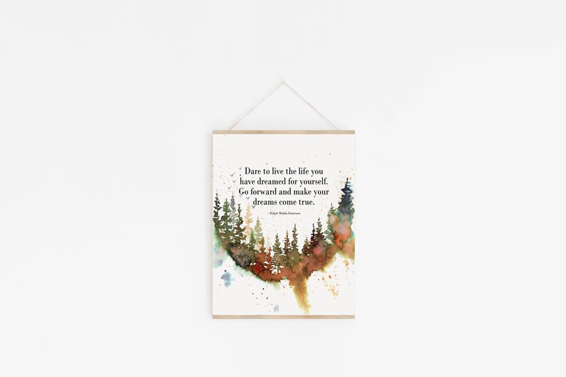 May include: A watercolor print with a quote about living the life you dream: "Dare to live the life you have dreamed for yourself. Go forward and make your dreams come true." The quote is surrounded by a watercolor painting of a forest.
