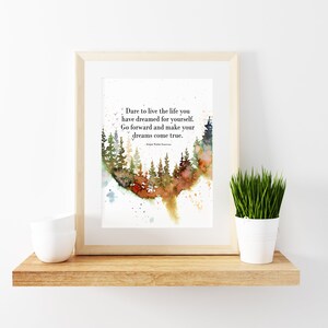 May include: A framed watercolor painting of a forest with a quote about living the life you dream. The quote reads: "Dare to live the life you have dreamed for yourself. Go forward and make your dreams come true." The quote is attributed to Ralph Waldo Emerson.