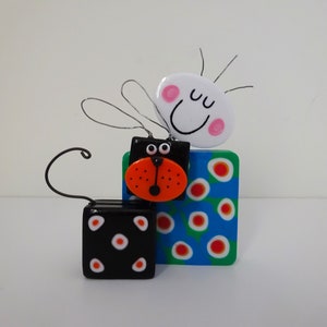 Whimsical Male Figurine Sculpture with Dog: Colourful Abstract Artwork