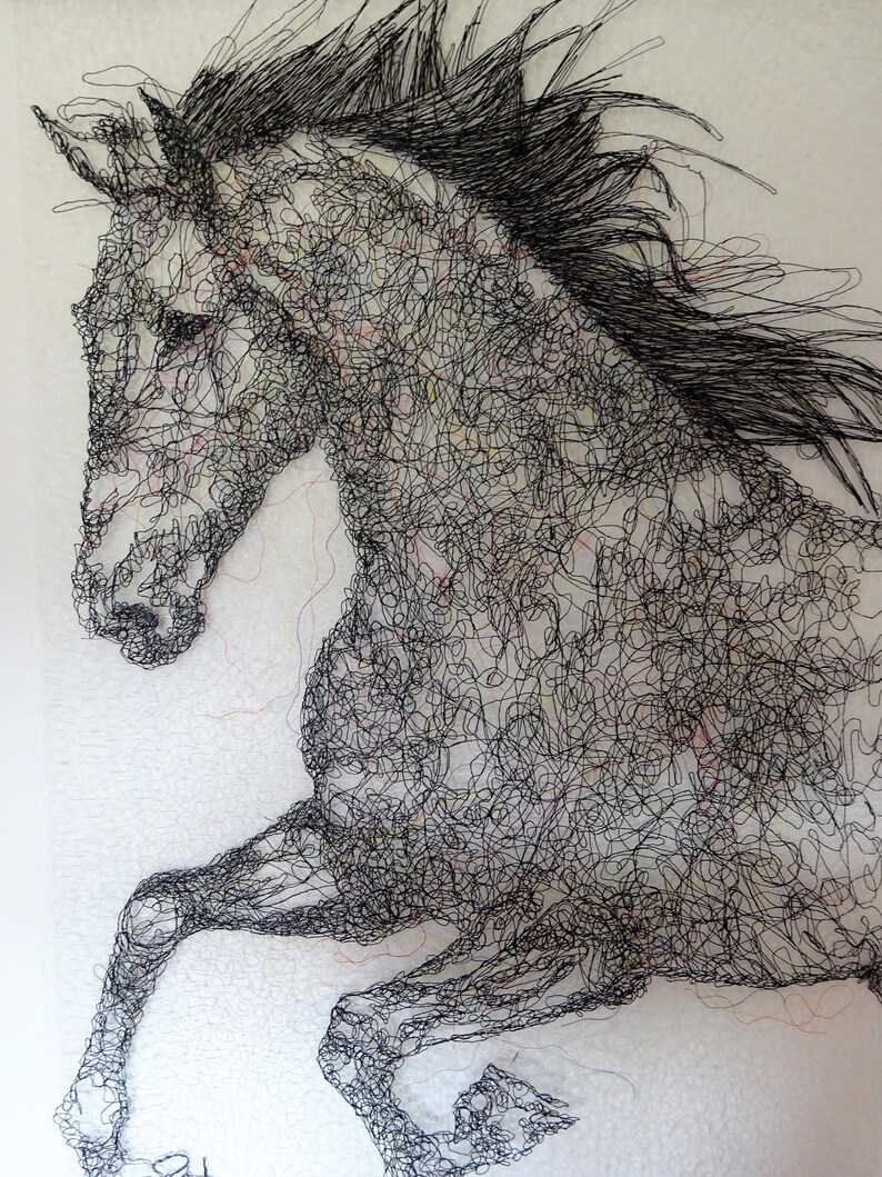 May include: A black and white wire sculpture of a horse rearing up on its hind legs. The horse is made of many small, intertwined wires that create a detailed and intricate design.