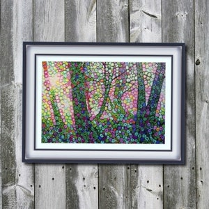 May include: A framed abstract painting of a forest scene with colorful dots and swirls. The trees are depicted in black and the background is a mix of pink, yellow, and green.