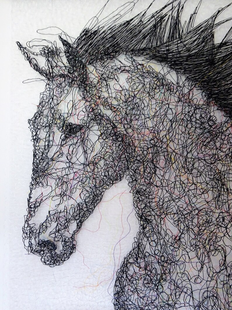 May include: A black and white line drawing of a horse's head, created with a tangled mass of black thread. The horse's eye is visible, and the mane is flowing.