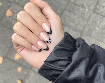 Black french nails-aesthetic nails-black nails-bow nails-nails with bows-trending nails-almond nails-medium nails-almond nails