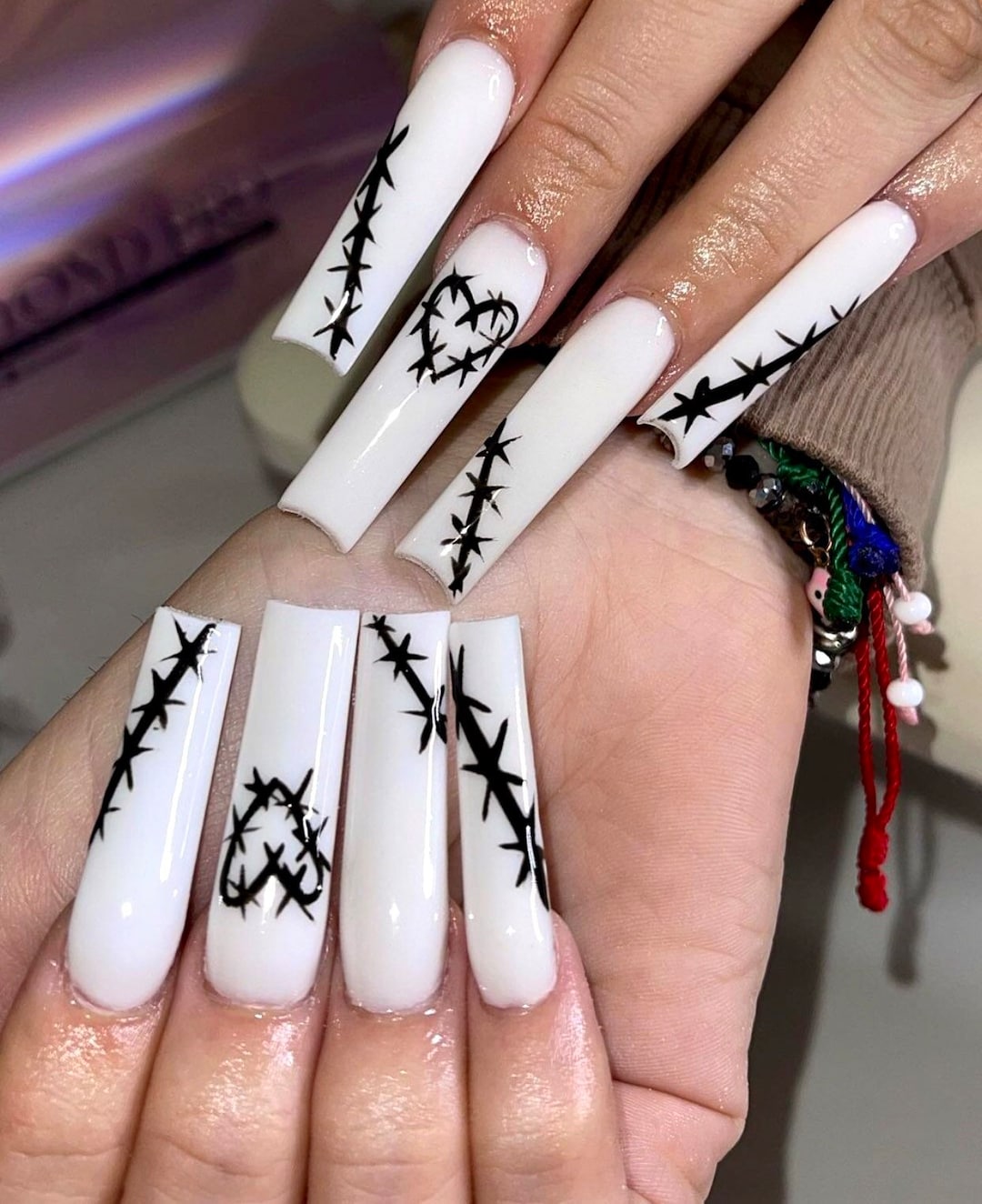 Karol G reveals her new edgy manicure
