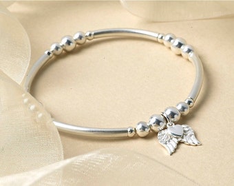 Sterling Silver Angel Wing Charm Bracelet: Beaded Stretch Jewelry