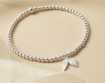 Sterling Silver Angel Wings Charm Bracelet: Beaded Stretch Jewelry