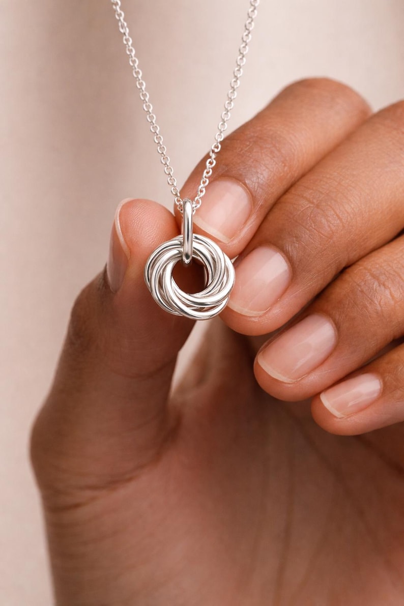 Close up of a 50th birthday silver necklace.