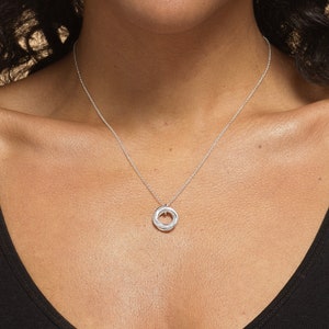 Close up of a 40th birthday gift.  Silver 4 rings necklace