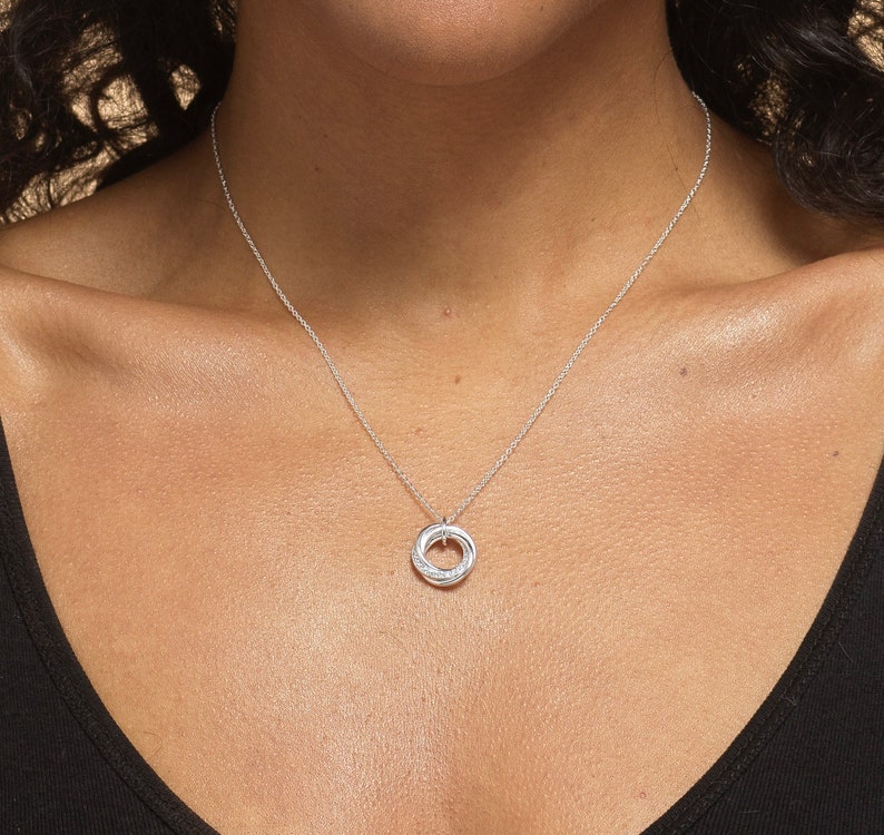 Close up of a 40th birthday gift.  Silver 4 rings necklace
