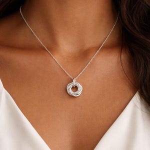 Model wearing a 50th birthday 5 ring necklace.