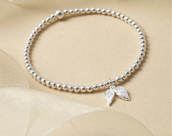 Sterling Silver Angel Wing Bracelet: Beaded Stretch Charm
