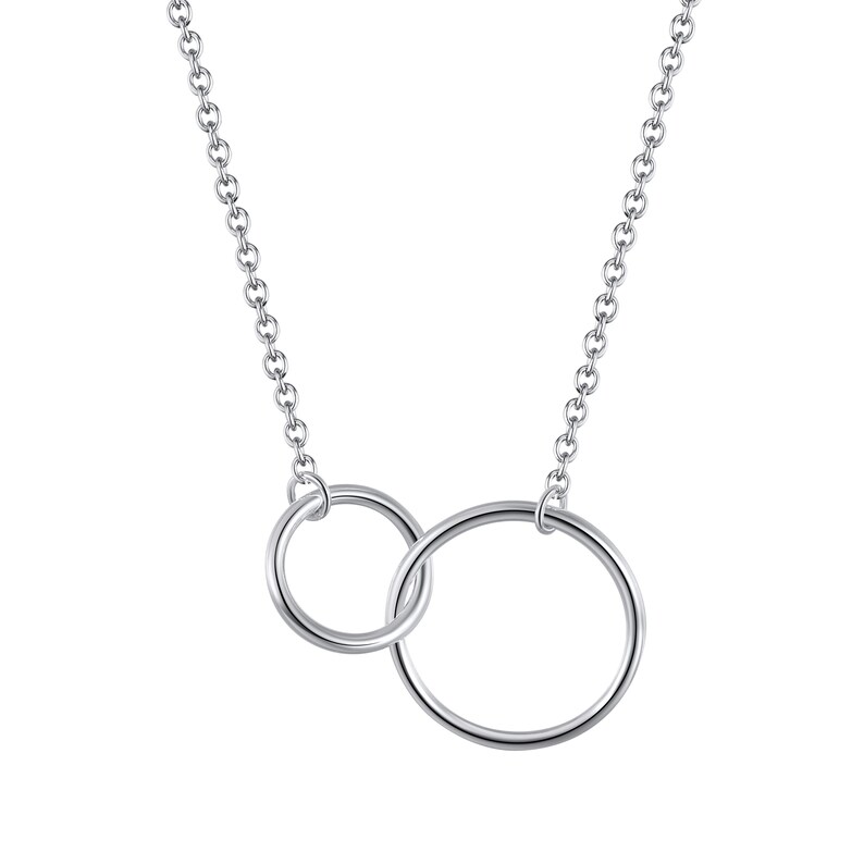 May include: A silver-coloured necklace featuring a delicate chain and two interlocking circular rings of different sizes. The polished metal rings are connected to the chain at the top, creating a simple, continuous design with a bright, reflective finish.