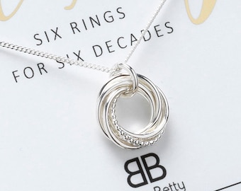 Six rings for six decades necklace sale