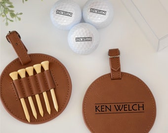May include: A brown leather golf ball holder with a personalized name tag. The holder has six slots for golf tees and a round leather tag with the name "KEN WELCH" engraved on it. Three white golf balls with the same name printed on them are also included.