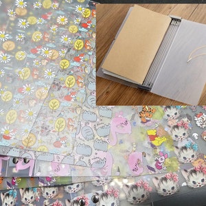 May include: A set of clear plastic sheet protectors with various colorful patterns, including cats, flowers, and cartoon characters. The protectors are designed for use with a ring binder or a disc bound planner.