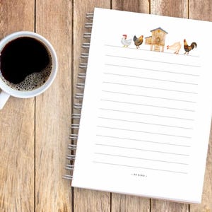 May include: A white spiral bound notebook with lined pages. The cover features a watercolor illustration of a chicken coop and chickens. The text "Be Kind" is printed at the bottom of the page.