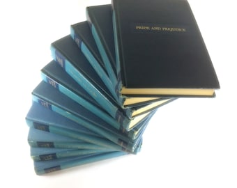 Alice in Wonderland, Pride & Prejudice Robinson Crusoe Huckleberry Finn Vintage Best Loved Classics sky blue book set circa 1949.
