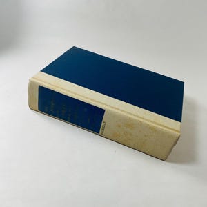 May include: A blue hardcover book with a white spine. The title of the book is "An Anthology of Irish Literature" and the author is "Edited by A. Norman Jeffares".