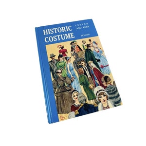 May include: A blue book titled "Historic Costume" by Lester and Kerr, revised edition. The cover features a colorful illustration of people in historical clothing.