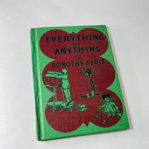 May include: A vintage hardcover book titled "Everything and Anything" by Dorothy Aldis. The cover has a green border and a red central design. The red design features illustrations of children and a spider. The book's title is in large, bold letters.