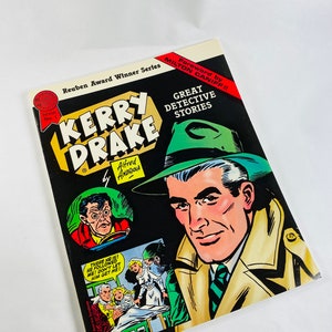 May include: A comic book cover featuring Kerry Drake, a detective, with the title "Great Detective Stories". The cover is black with yellow, red, and green accents. The comic book is part of the Reuben Award Winner Series.