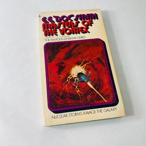 May include: A vintage paperback science fiction book titled Masters of the Vortex by E.E. Doc Smith. The cover features a dark blue spaceship flying through a swirling red and orange nebula with the text Nuclear Storms Ravage the Galaxy below.
