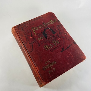 May include: A red book with gold lettering titled "Peck's Bad Boy and His Pa Complete and Compendium of Fun". The cover features an illustration of a man and children.