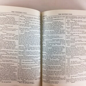 May include: Open book with text from "The Winter's Tale" on aged paper. The pages are yellowed, and the text is in black. The book is open to a double-page spread, with text filling both sides.