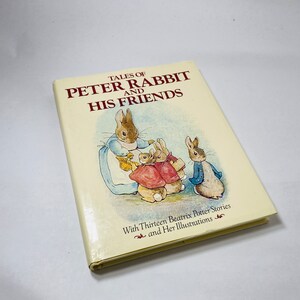 May include: A book titled "Tales of Peter Rabbit and His Friends" with a cover illustration of Peter Rabbit and his family. The book includes thirteen Beatrix Potter stories and illustrations.