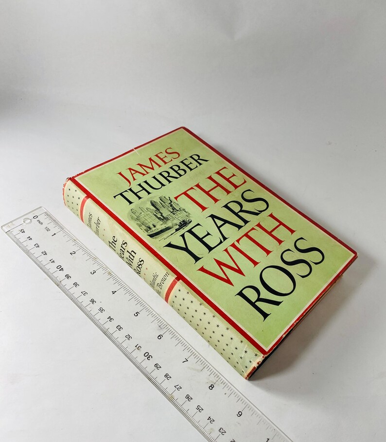 May include: A hardcover book titled "The Years With Ross" by James Thurber. The book has a light green cover with red and black text. A clear ruler is placed next to the book.