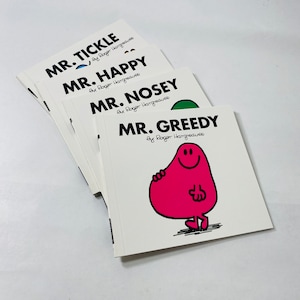 May include: A stack of four Mr. Men books featuring Mr. Tickle, Mr. Happy, Mr. Nosey, and Mr. Greedy. Each book has a colorful illustration of the character on the cover.