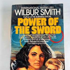1987 Power of the Sword Vintage paperback Book war novel by Wilbur Smith military combat paperback book about World War II.