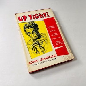 May include: A vintage paperback book titled "Up Tight!" with a yellow cover featuring a black and white illustration of a man. The book's subtitle is "John Gimenez as told to Char Meredith".