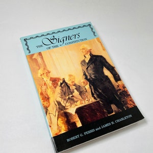 May include: A book titled "The Signers of the Constitution" with a painting of four men in formal attire. The book is by Robert G. Ferris and James H. Charleton.