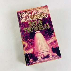 Man of Two Worlds vintage paperback book by Frank Herbert circa 1987 Scifi story set on Earth about being watched and manipulated by aliens