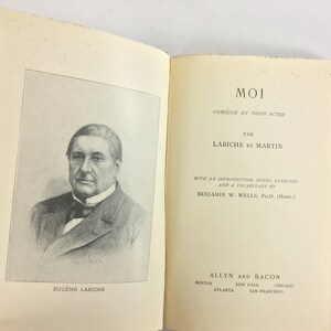 May include: A black and white portrait of Eug&egrave;ne Labiche, a French playwright, with the title "MOI" and the text "COM&Eacute;DIE EN TROIS ACTES" above it. The text "PAR LABICHE ET MARTIN" is below the title. The text "WITH AN INTRODUCTION, NOTES, EXERCISES AND A VOCABULARY BY BENJAMIN W. WELLS, PH.D. (HARV.)" is below the author's names. The text "ALLYN AND BACON" is at the bottom of the page, with the cities "BOSTON, ATLANTA, NEW YORK, CHICAGO, SAN FRANCISCO" listed below.