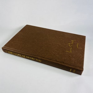 Story of Henri Tod by William F Buckley vintage book circa 1984 set in East Germany. Brown bookshelf decor