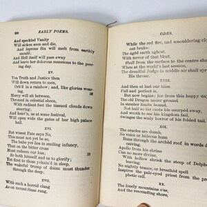 May include: Open book with aged, yellowed pages featuring poetry. The left page displays "EARLY POEMS" and the right page reads "ODES." Text is in black ink. The book is open to pages 100 and 101, with a visible binding.