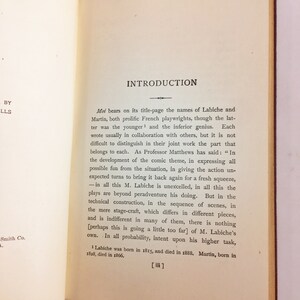 May include: A page from a book titled "Moi" with an introduction about the French playwrights Labiche and Martin. The text discusses their collaboration and individual contributions to their work. The page is printed on white paper with black ink.
