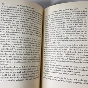 May include: Open book with text on aged paper. The left page features the title "THE YEARS WITH BOSS" and text. The right page has the title "MENCKEN AND NATHAN AND ROSS" and text. The pages are slightly yellowed.