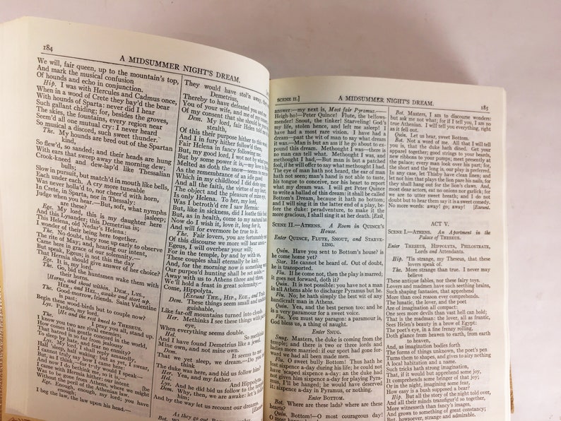 May include: Open book with pages displaying text from Shakespeare's "A Midsummer Night's Dream." The text is in a classic serif font. The book is open to Act V, with the title visible. The pages are aged, with a warm, yellowed tone.